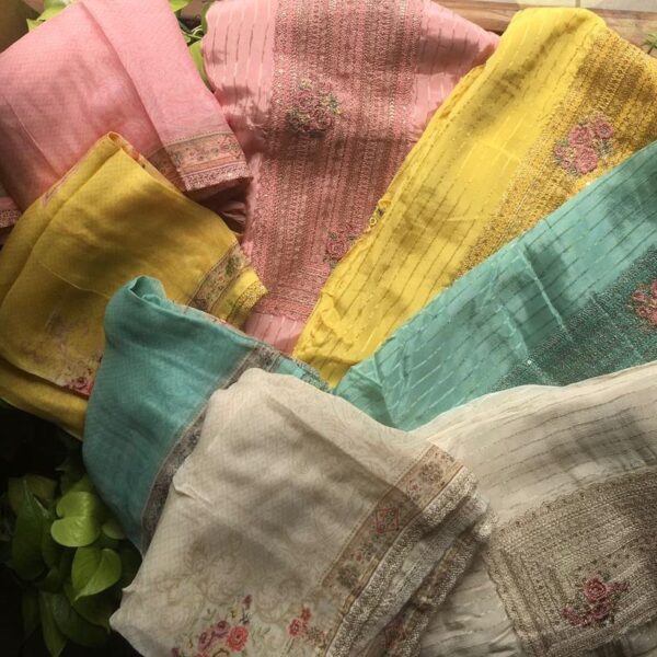 A Premium designer collection in Pure premium crepe silk top with exquisite hand embroidery & embroidery detailing for sleeves & hemline , santoon bottom & pure organza Duppatta with beautiful embroidery borders & floral prints