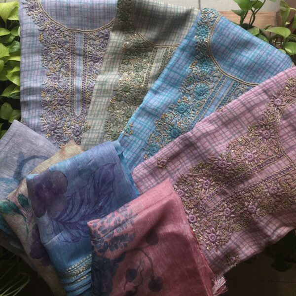 A beautiful designer Linen floral collection in Linen top with unique check prints ,exquisite hand embroidery, santoon bottom & beautiful Silk floral Duppatta