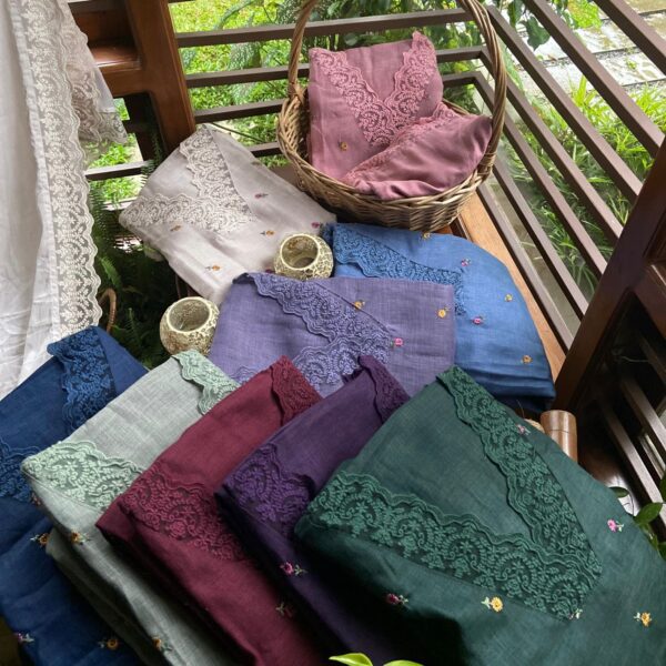 A Beautiful Festive Designer Onam Collection Launch in Linen Cotton Suits with an intricate & beautiful neckline & sleeve borders created with lovely French lace detailing & beautiful floral embroidery all along top. Cotton silk bottom & a very beautiful Duppatta with entire borders created of French lace