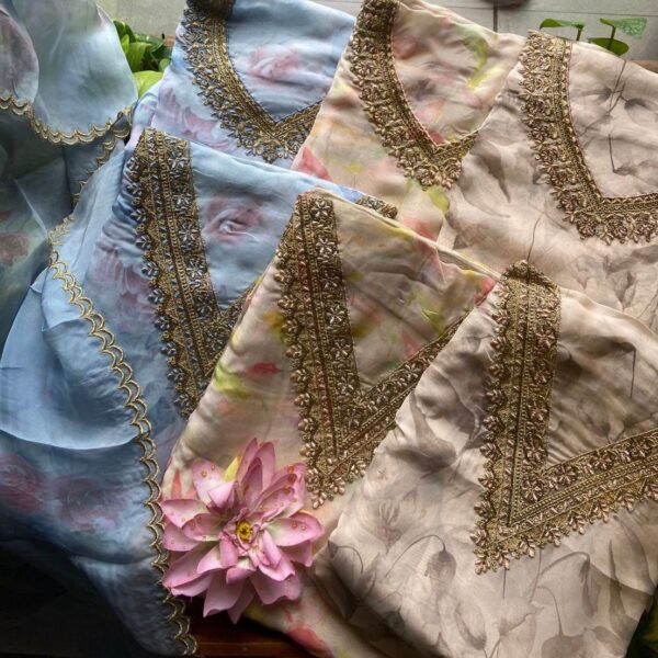 An ethereal collection in Pure Viscose Floral Organza!!! A dreamy affair in pure organza in lovely color palette, elegant floral prints , exquisite hand embroidery and unique double scalloping on duppatta. Santoon bottom