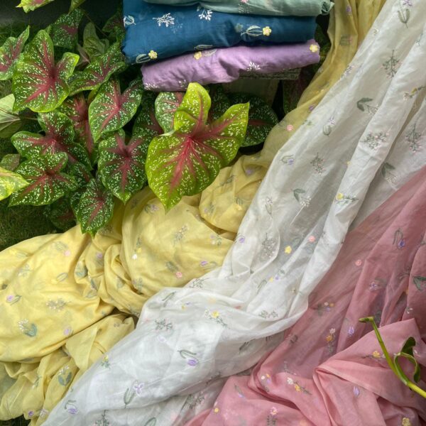Running fabrics in pure 40gm Mul Chandheri with the most dainty floral embroidery in beautiful pastel tones! You can avail a minimum of half metre to the no of metres you require to design your attire !