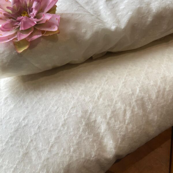 An ethereal Ivory Offwhite Running fabric in pure Mal Chandheri with intricate Jamdhani weaving throughout in a beautiful ethnic design giving it a stunning feel! Dyeable to the color of your choice ! The fabric can be cut in meterage as per your requirement. The fabric with Jamdhani weaving is ideal to converted as saree , Kaftan , suit or frock & is entirely dyeable to the shade of your choice