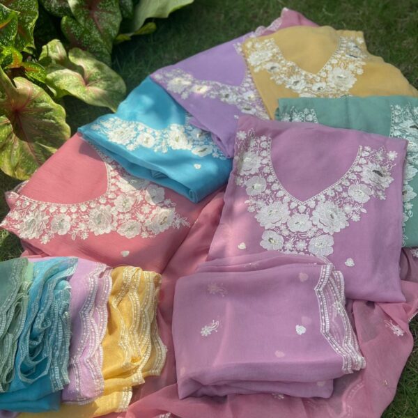 A Beautiful designer collection in Pure Crush Georgette top and Duppatta with exquisite floral embroidery , scattered buttas and scalloped borders and cotton silk bottom