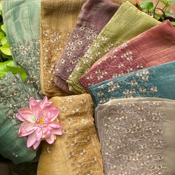 Presenting Our Beautiful New designer wear in Tissue Organza top with exquisite embroidery on the top & Duppatta in a very pretty floral pattern & cotton silk bottom . Handcrafted in beautiful pastel hues with antique gold hue these are the perfect choice for Onam !
