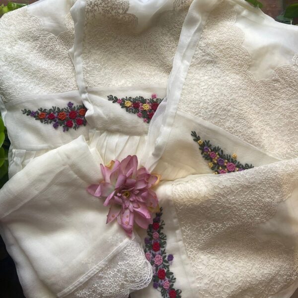 A beautiful Edit for Onam in ethereal Offwhite with exquisite hand embroidery & French lace detailing A Beautiful designer collection in Pure Crush Georgette top & Duppatta with exquisite hand embroidery featuring bullion knots embroidery, fine French lace borders for Duppatta & cotton silk bottom (Unstitched)