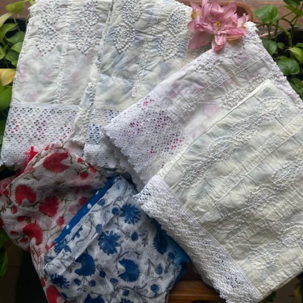 A beautiful collection of pure cotton top with French knot embroidery & block prints creating the illusion of a princess cut , cotton bottom & chiffon Duppatta with Bandhej & floral block prints