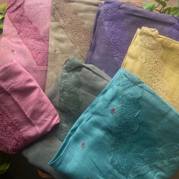 Beautiful Pure Linen cotton top with pretty tiny floral embroidery scattered throughout length of top , French lace detailing at neck and sleeve ends , cotton bottom and Mal Chandheri Duppatta with French lace borders