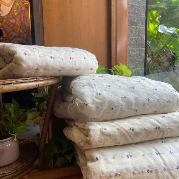 Running fabrics in pure Malai Chandheri with the most dainty floral Embroidery!You can avail a minimum of half metre to the no of metres you require to design your attire ! Styling tip : These fabrics are so pretty & elegant & can be used to design Dainty blouses,Kaftans, Salwar Suits, Designer sarees with scalloping or crochet edging Cute little frocks for girls or little kurtas for boys