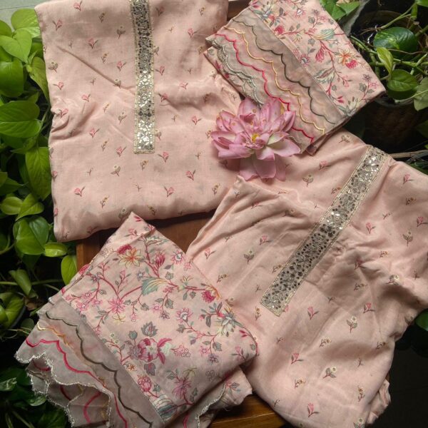 A beautiful collection of Pure muslin top with floral block prints & organza embroidery detailing , santoon bottom & muslin designer embroidered Duppatta