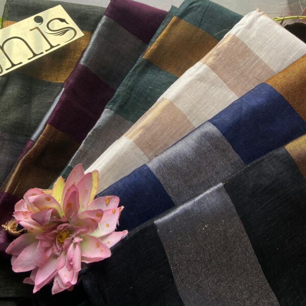 A stunningly gorgeous premium Handloom Linen silk saree with beautiful hand weaving of vertical stripes along saree creating a beautiful vintage feel. The saree is delicately adorned with tassels adding to the style quotient and the plain linen silk blouse can be styled as per your choice. A beautiful choice for gifting your dear ones this Christmas season