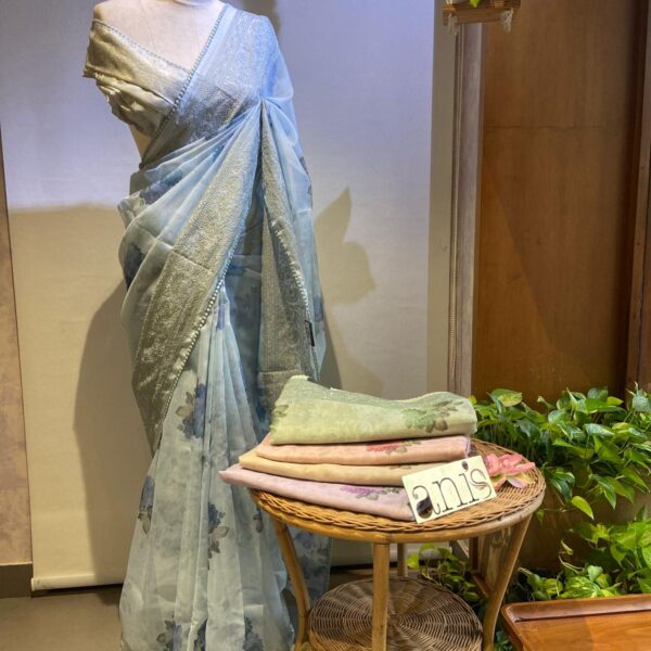 A stunningly gorgeous premium kota silk saree with beautiful Floral prints & Chikankari embroidery all along saree & pallav. The saree is delicately adorned with a gorgeous floral printed blouse makes it a beautiful choice for gifting your dear ones this Christmas season