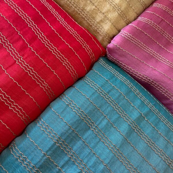 Beautiful Running fabrics in pure Malai Chandheri with the most stunning antique Zari embroidery !You can avail a minimum of half metre to the no of metres you require to design your attire Styling tip : These fabrics are so pretty & elegant & can be used to design Sarees, Dainty blouses,Kaftans, Salwar Suits, Designer sarees with scalloping or crochet edging Cute little frocks for girls or little kurtas for boys