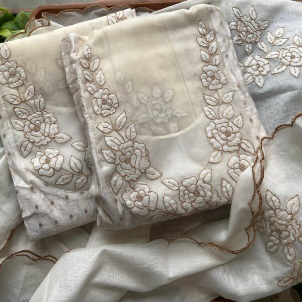 Are you looking out for a Beautiful Designer Offwhite Suit to add to your wardrobe ? This stunner in Offwhite & Gold is the perfect choice! Pure Benarasi Chandheri silk top with intricate embroidery & lace detailing at yoke front back & sleeves , cotton silk bottom & sold ok Duppatta with scallop & embroidery