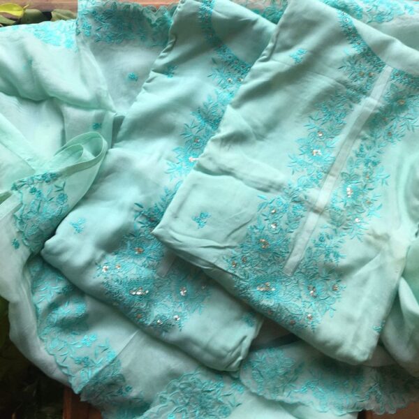 Are you looking out for Beautiful & Unique Designer Suits to add to your wardrobe ? This beautiful Aquamarine suit with intricate embroidery is the perfect choice! Uppada silk top with intricate embroidery, santoon bottom & organza Duppatta with embroidery
