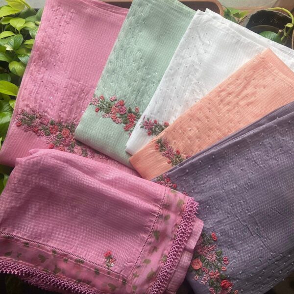 Are you looking out for Beautiful Kota suits to add to your wardrobe ? These Handworked Kota Suits are the perfect choice! Kota silk top with hand embroidery, organza floral printed border on sleeve ends & cotton bottom ends & Kota silk Duppatta with floral borders & hand embroidery